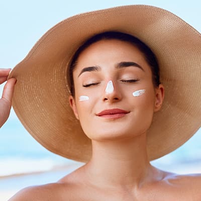Beautiful,Woman,Face.,Skin,Care,Concept.,Suncream.,Suntan,Lotion,Beautiful Florida Dermatologist: Cosmetic, Pediatric & Medical | Suncoast Skin